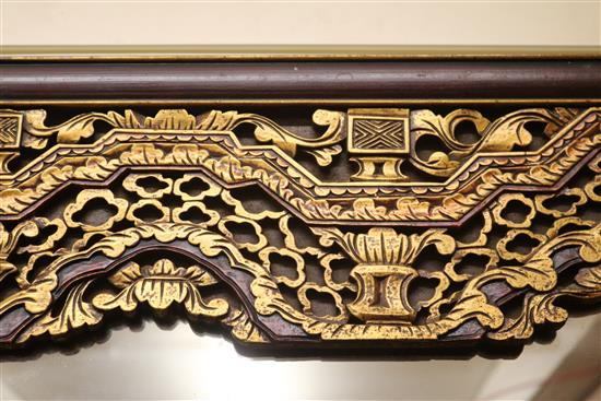 A Chinese carved and parcel-gilt wall mirror W.122cm